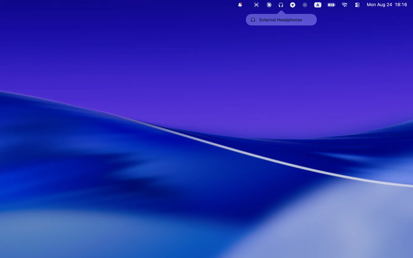 The output switched to External Headphones, shown under the menu bar icon